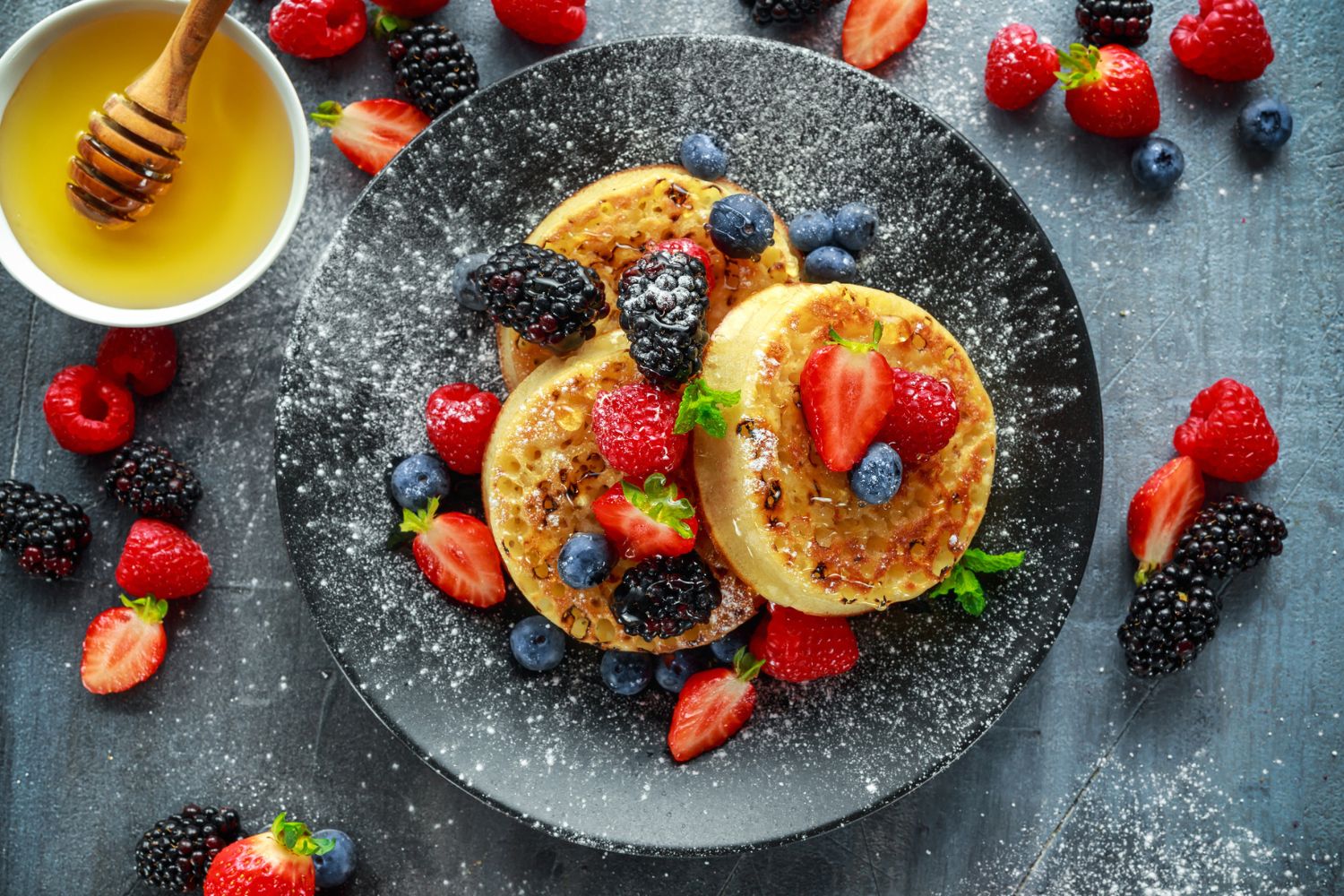 Homemade crumpets, ricotta, berries, thyme honey