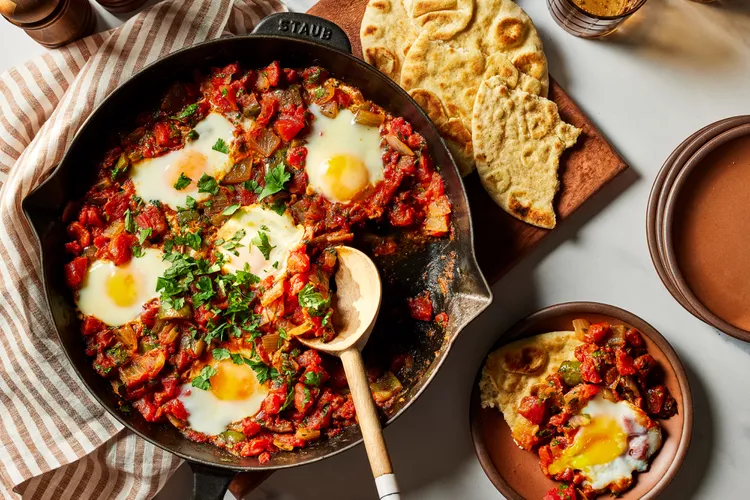 Shakshuka (Tomato-Pepper Stew with Poached Eggs and Harissa)